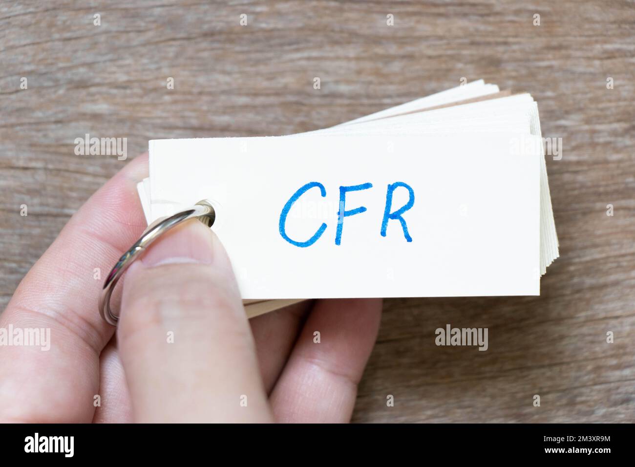hand-hold-flash-card-with-handwriting-in-word-cfr-abbreviation-of-cost