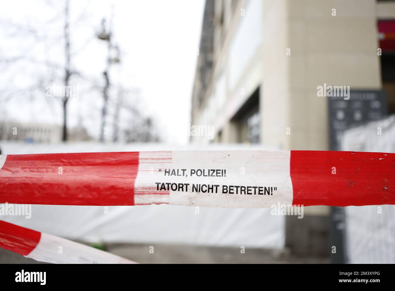 12/17/2022, Berlin, Germany, Police tape in front of the locked hotel from the outside. The day after the accident - the Berlin Aquadom was completely closed off. AquaDom in the Berlin hotel 'Radisson Blu' burst  on friday 12/16/22 and around 1 million liters of water with all the fish spilled out.. Stock Photo