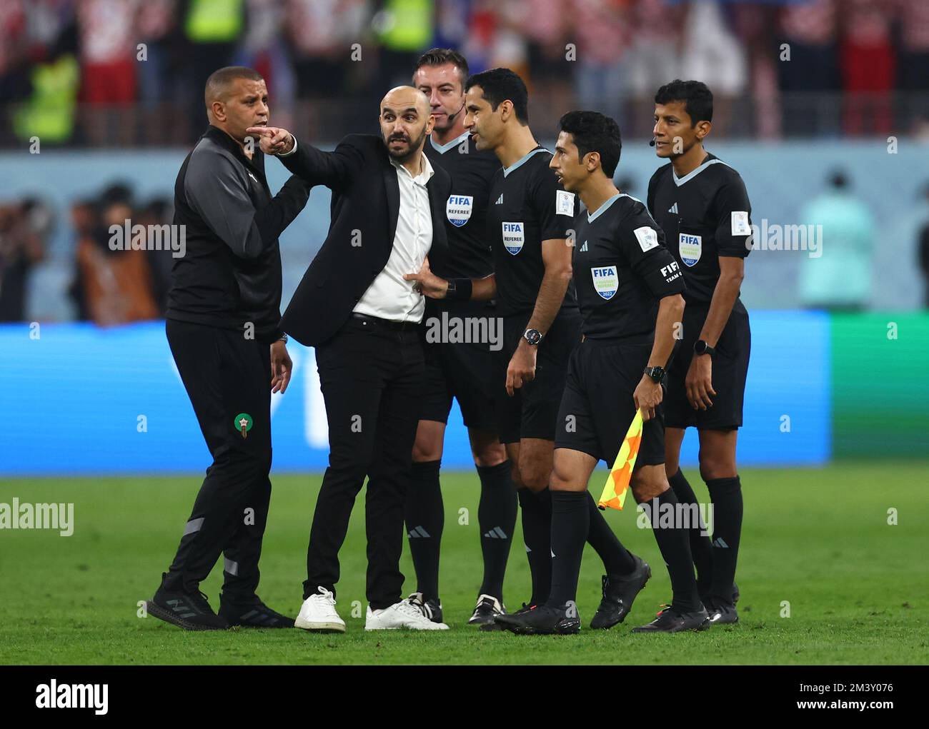Doha, Qatar. 17th Dec, 2022. Walis Regragui coach of Morocco has words with referee Abdulrahman Al Jassim during the FIFA World Cup 2022 match at Khalifa International Stadium, Doha. Picture credit should read: David Klein/Sportimage Credit: Sportimage/Alamy Live News Stock Photo