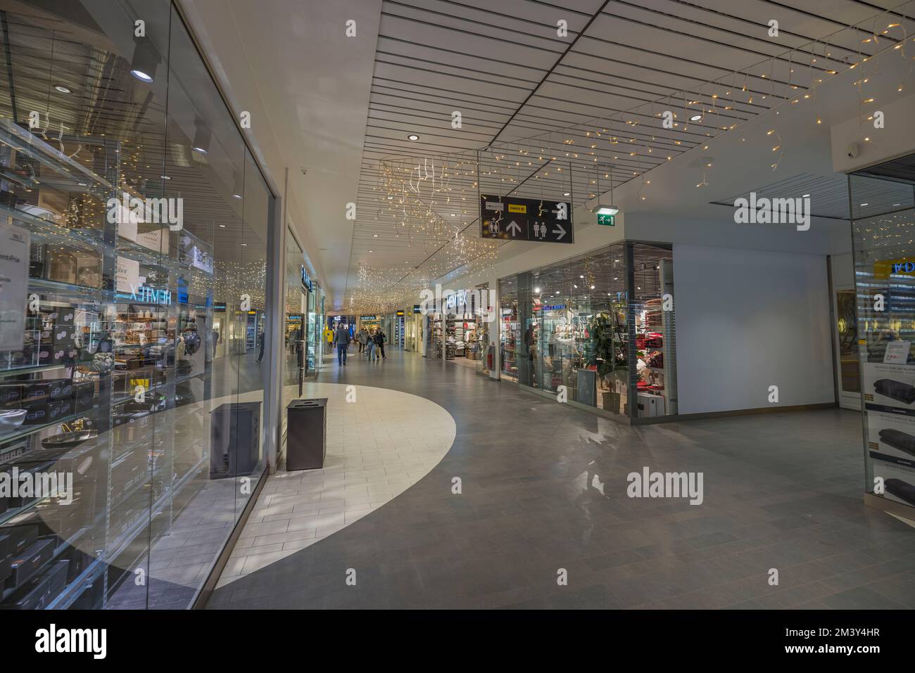 Beautiful view of interior of hypermarket with small department stores. Sweden. Uppsala. Stock Photo