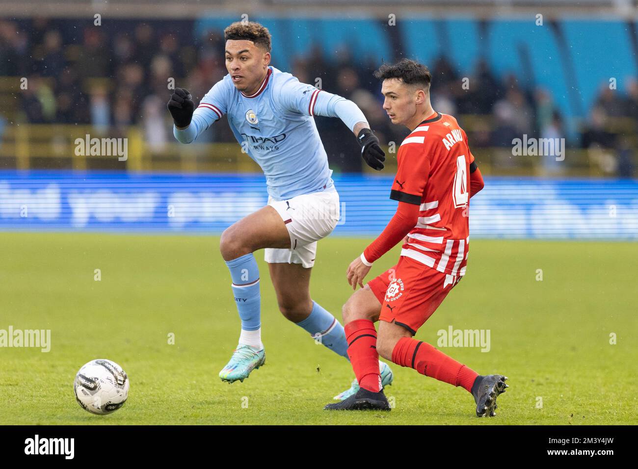 Morgan Rogers of Manchester City pressures Arnau Martinez #4 of Girona during the Mid season friendly match Manchester City vs Girona at Etihad Campus, Manchester, United Kingdom, 17th December 2022  (Photo by Phil Bryan/News Images) Stock Photo