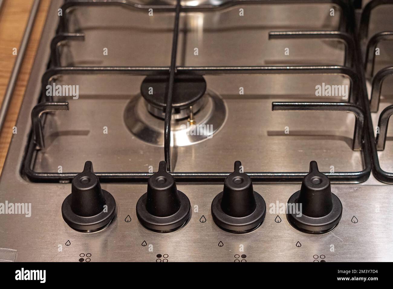 Four controls buttons at gas burning stove top kitchen Stock Photo Alamy