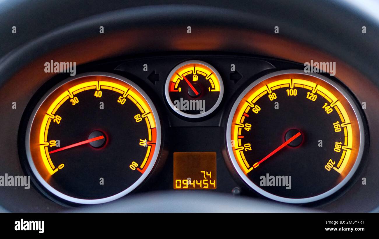 Analog car dashboard gauges with yellow lights Stock Photo Alamy