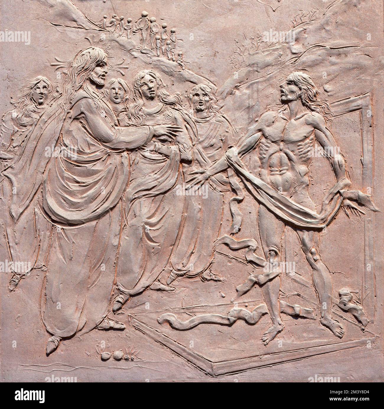 VARENNA, ITALY - JULY 20, 2022: The modern bronze relief Resurrection of Lazarus on the gate of church Chiesa di Santa Marta by Giuseppe Abramini Stock Photo