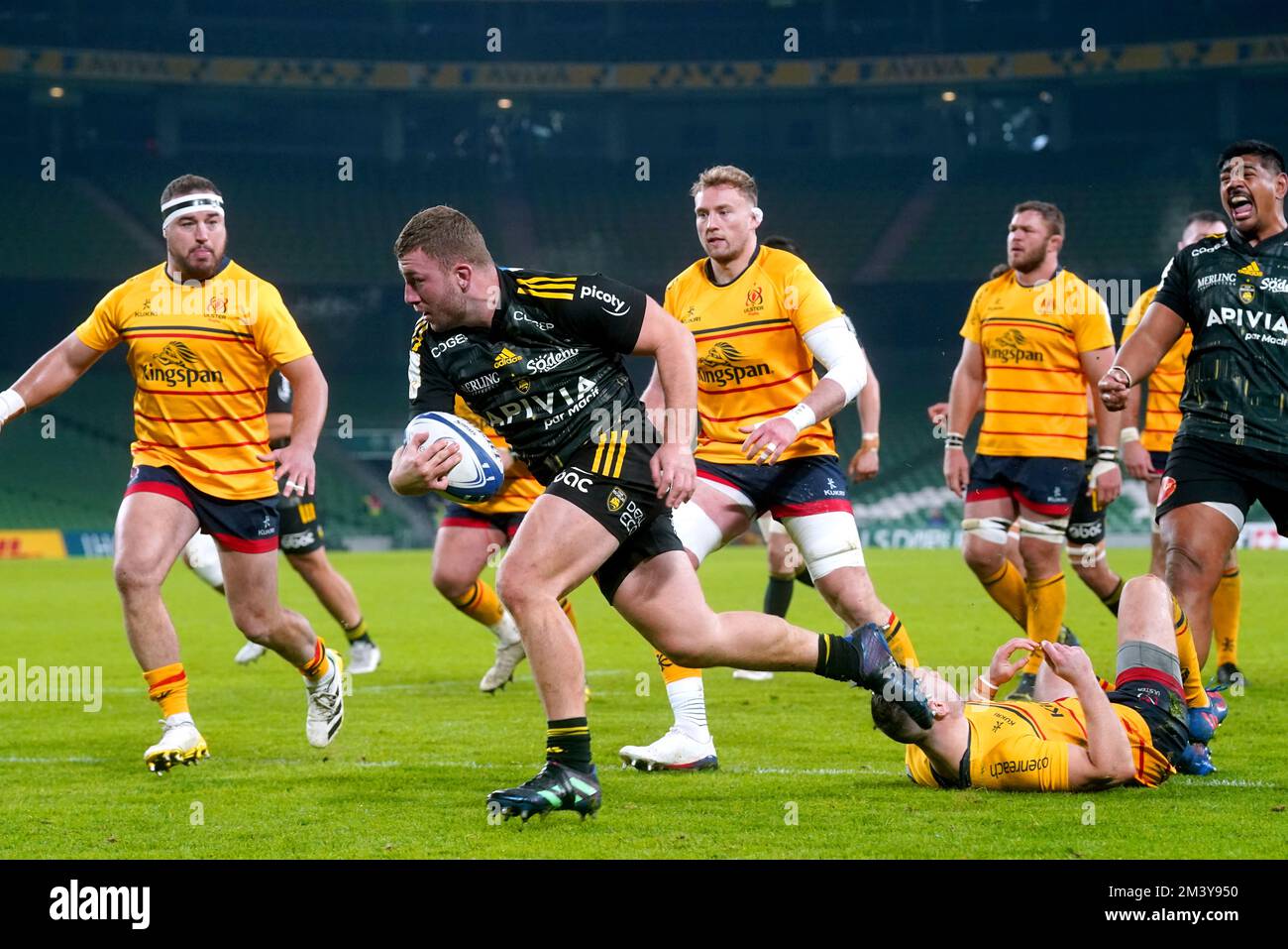 La Rochelle's Pierre Bourgarit evades being tackled by Ulster Rugby's