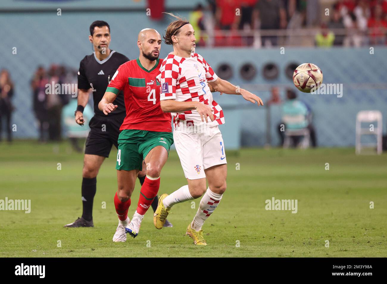 Roman Qatar December 17, 2022, Rome, Qatar: Lovro Majer of Croatia, Sofyan Amrabat ...
