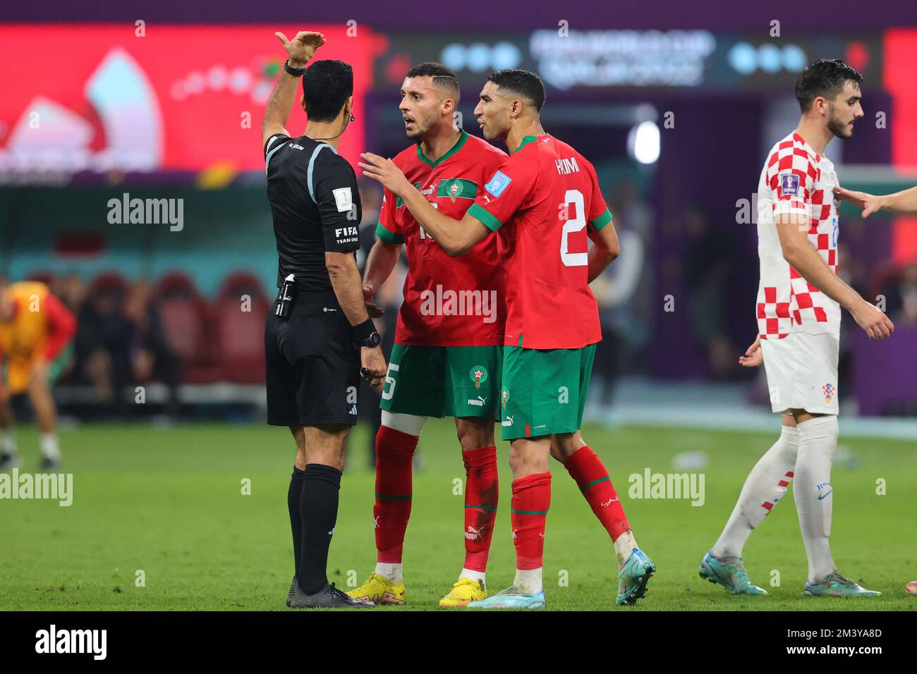 Doha, Qatar. 17th Dec, 2022. Selim Amallah of Morocco rand Achraf Hakimi of Morocco react to referee Al Jassim Abdulrahman of Qatar during the FIFA World Cup Qatar 2022 3rd place play-off match between Croatia and Morocco at Khalifa International Stadium, Doha, Qatar on 17 December 2022. Photo by Peter Dovgan. Editorial use only, license required for commercial use. No use in betting, games or a single club/league/player publications. Credit: UK Sports Pics Ltd/Alamy Live News Stock Photo