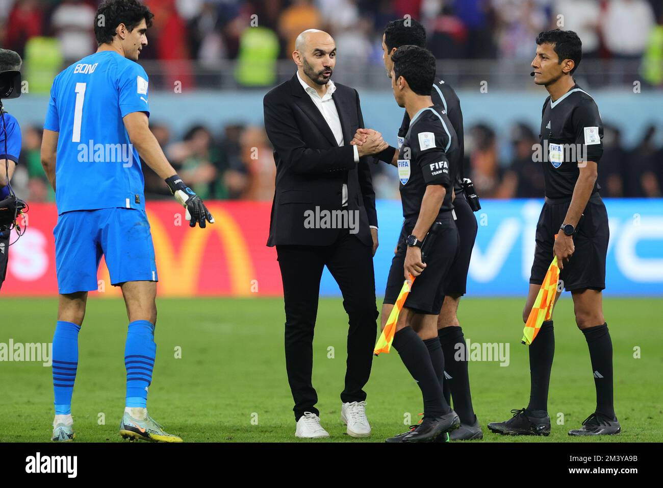 Doha, Qatar. 17th Dec, 2022. Walid Regragui Head Coach of Morocco shakes the hand of referee Al Jassim Abdulrahman of Qatar at the end of the match during the FIFA World Cup Qatar 2022 3rd place play-off match between Croatia and Morocco at Khalifa International Stadium, Doha, Qatar on 17 December 2022. Photo by Peter Dovgan. Editorial use only, license required for commercial use. No use in betting, games or a single club/league/player publications. Credit: UK Sports Pics Ltd/Alamy Live News Stock Photo