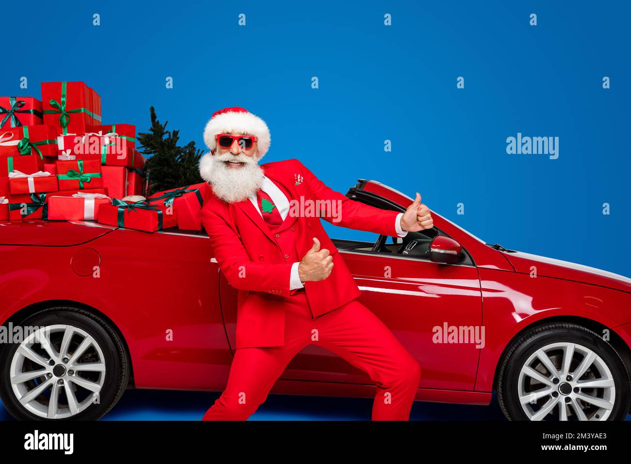 Photo of excited funny santa claus wear costume riding red vehicle ...