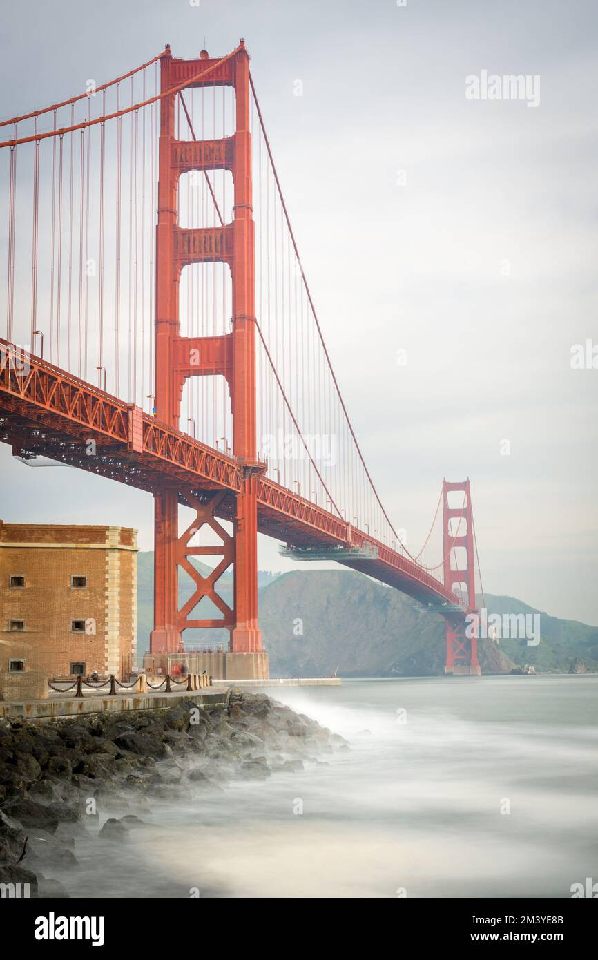 A vertical shot of the majestic view of the Golden Gate Bridge in San ...