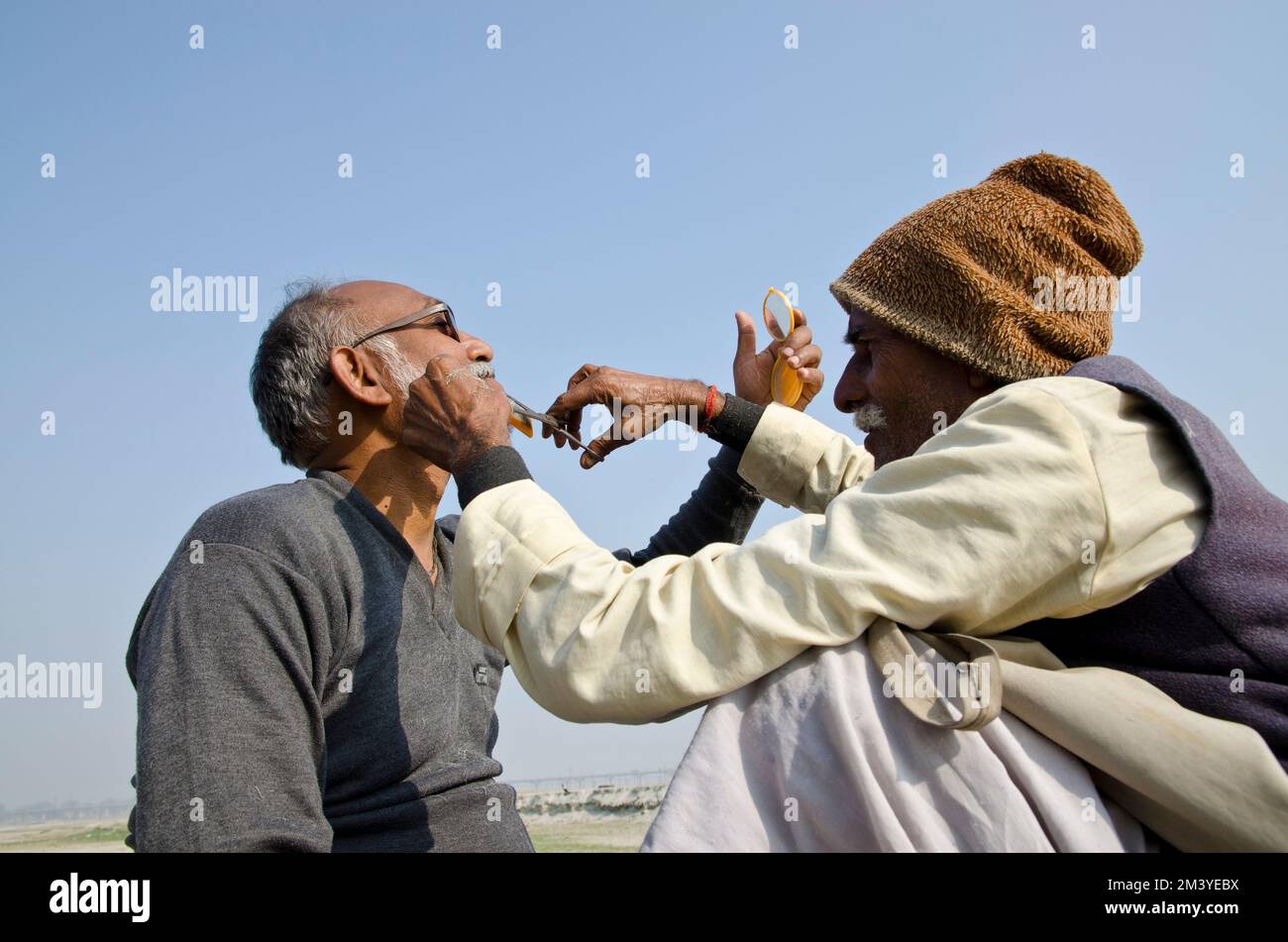 Small Head Ritual Shaving the head is often part of religious rituals at Sangam, the ...
