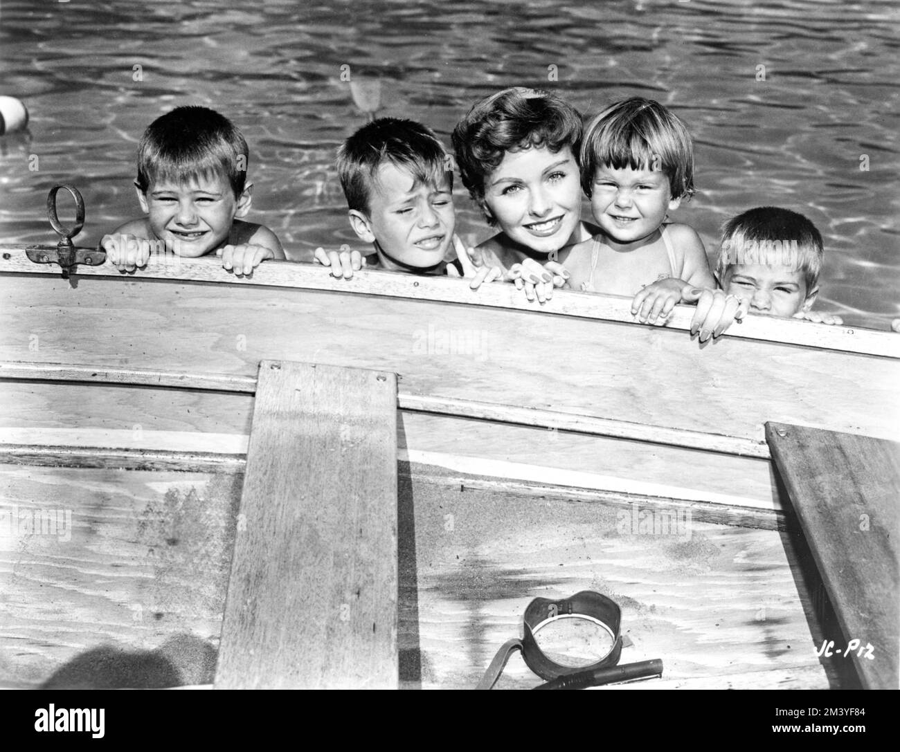 JEANNE CRAIN with her first four children MICHAEL BRINKMAN (Born 1949) PAUL BRINKMAN (b. 1947) JEANINE (B.1952) and TIMOTHY (b.1950) publicity for GENTELMEN MARRY BRUNETTES 1955 director RICHARD SALE Russ-Field Productions / United Artists Stock Photo