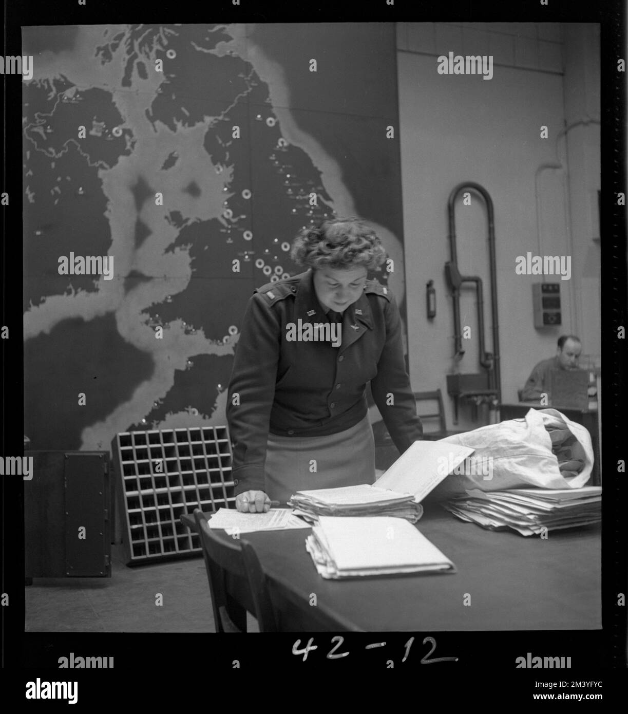 Lt. Virginia N. Justy, 502 1/2 South Ogden St., Los Angeles, Calif., in front of Airdrome status map in ops. room, Toni Frissell, Antoinette Frissell Bacon, Antoinette Frissell Stock Photo