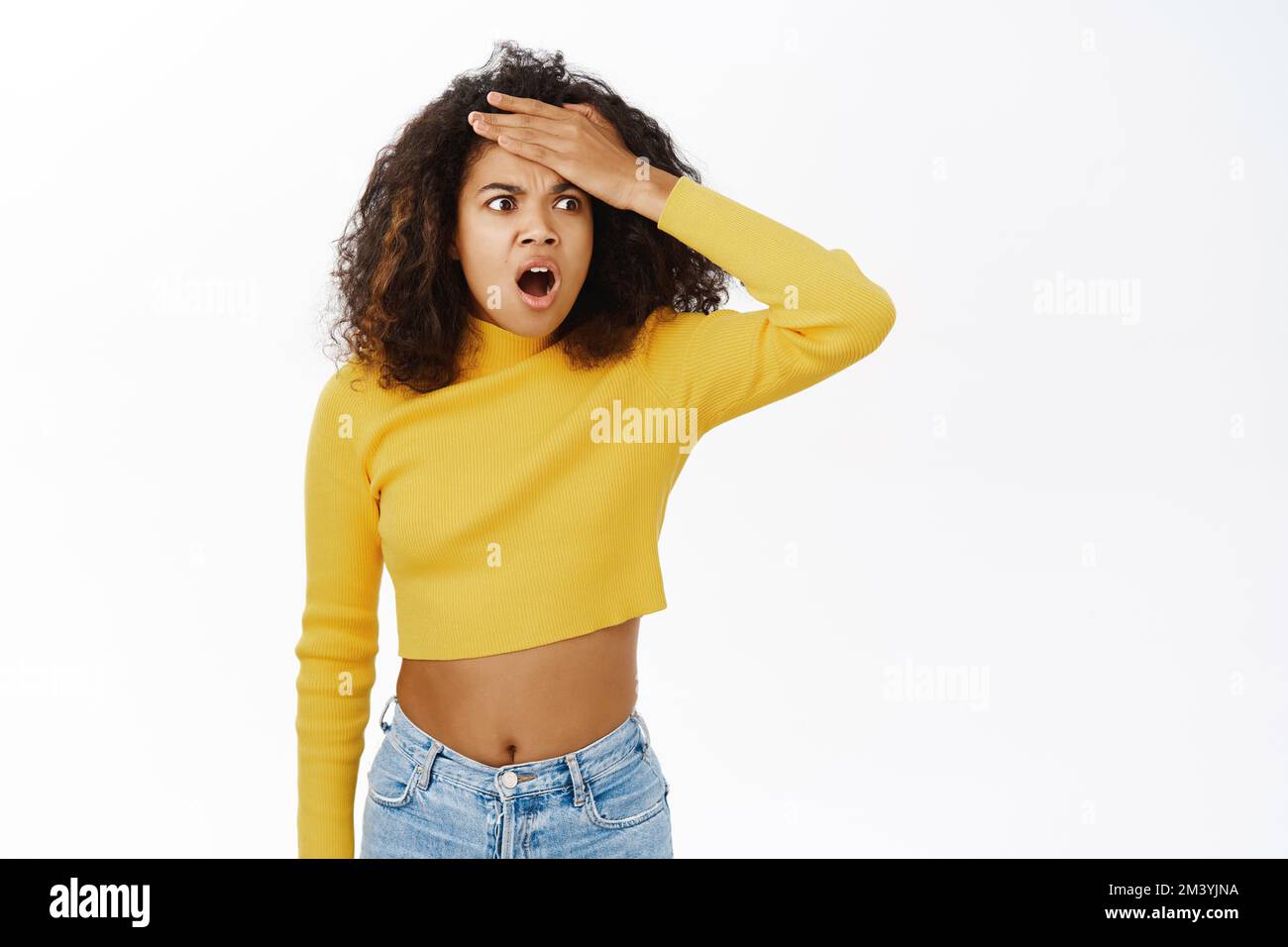 Portrait of shocked, concerned black woman, slap her forehead, looking ...
