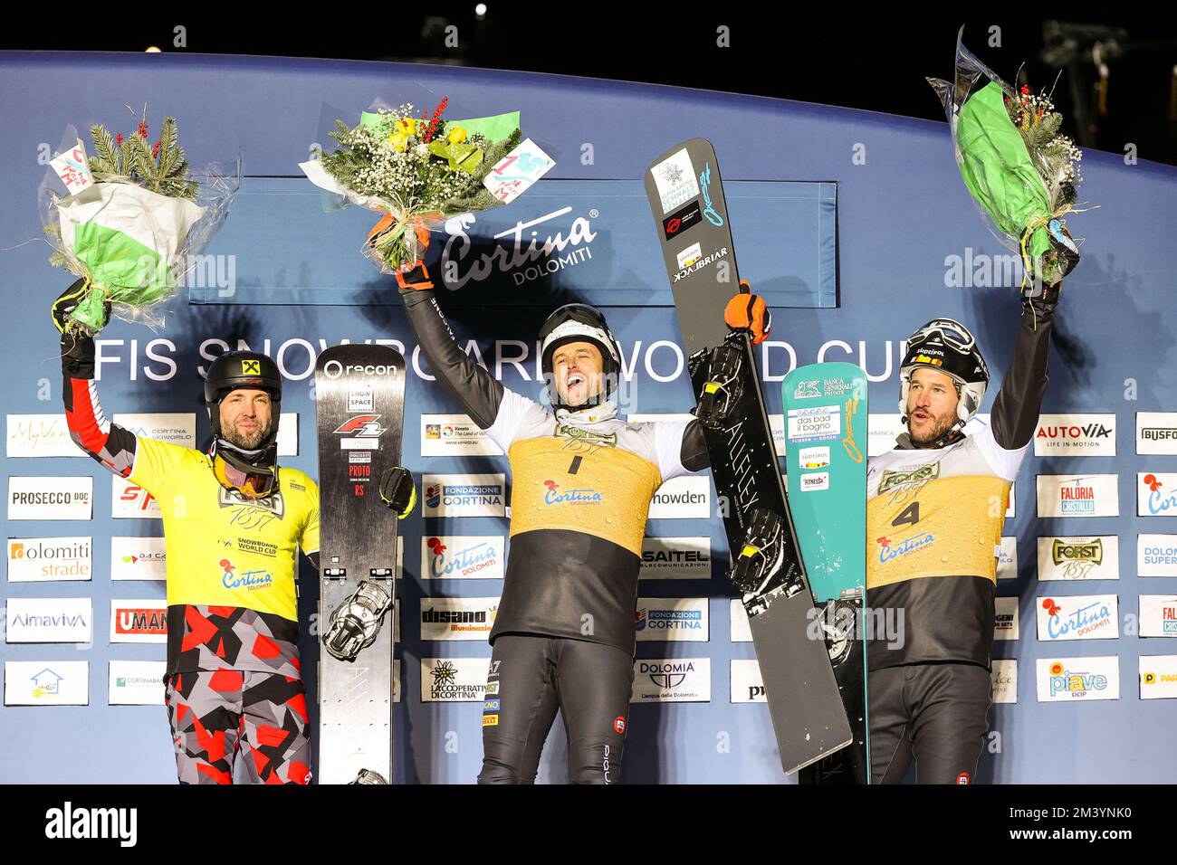 The podium with FISCHNALLER Roland (ITA), PROMMEGGER Andreas (GER) and MARCH Aaron (ITA) during Men's Parallel Giant Slalom, Snowboard in Cortina d'Ampezzo, Italy, December 17 2022 Stock Photo