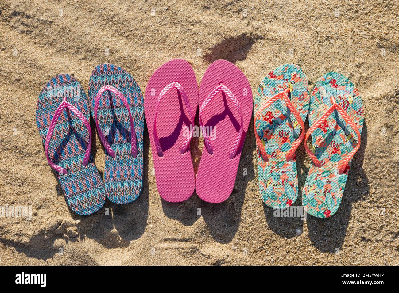 Flat lay three pairs flip flops Stock Photo - Alamy