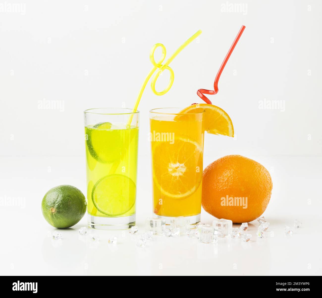 Front view fruit juice glasses with straws Stock Photo Alamy
