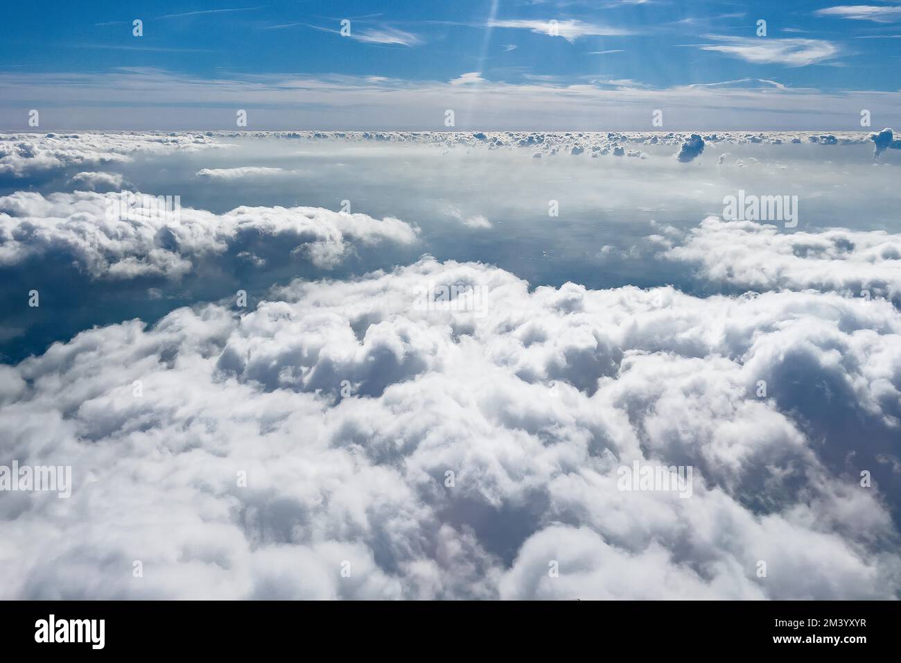 View from above stratocumulus clouds cluster layer clouds, in the background above altostratus altostratus clouds, Germany Stock Photo