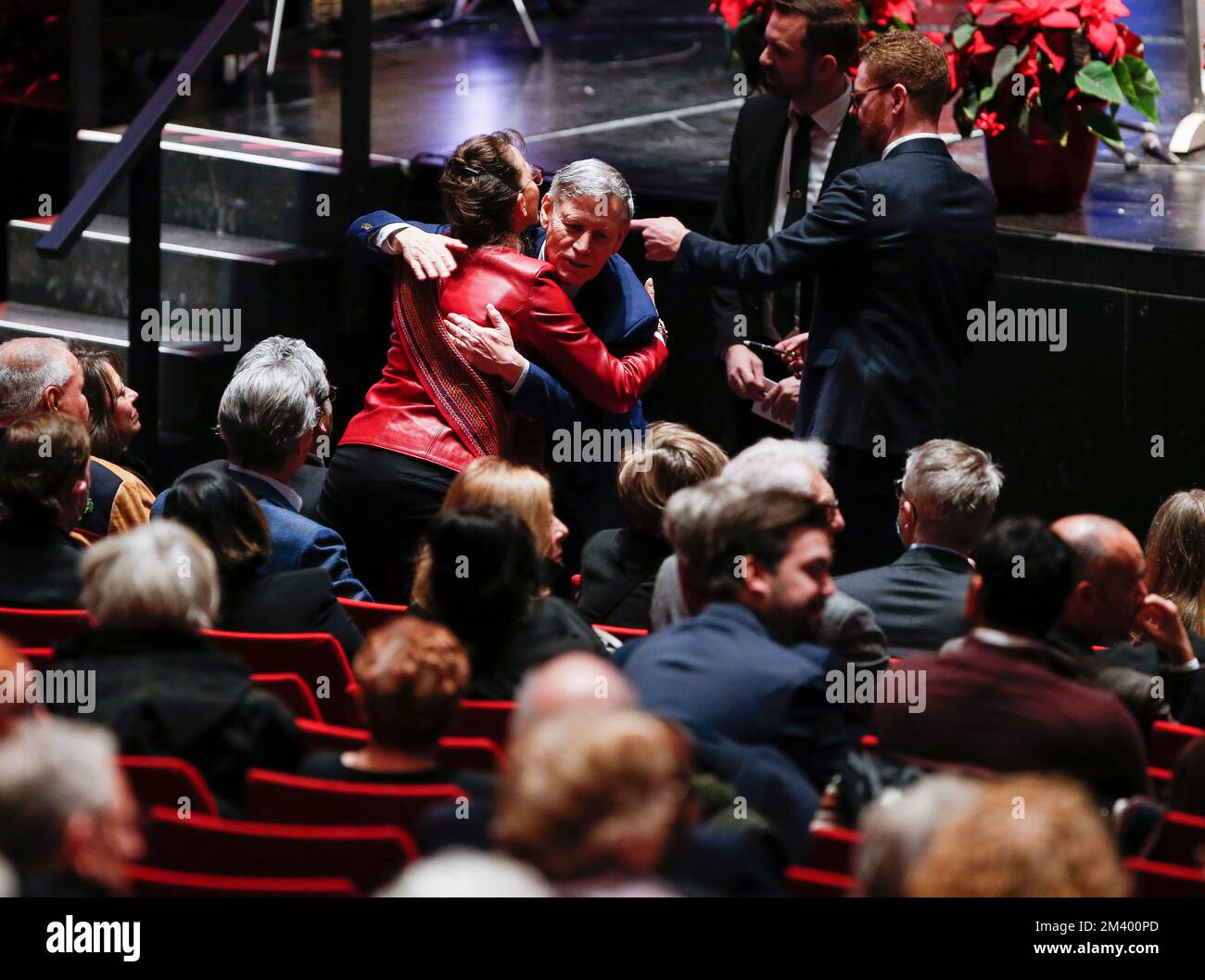 Terry Duguid, MP, hugs family and friends at a memorial service for