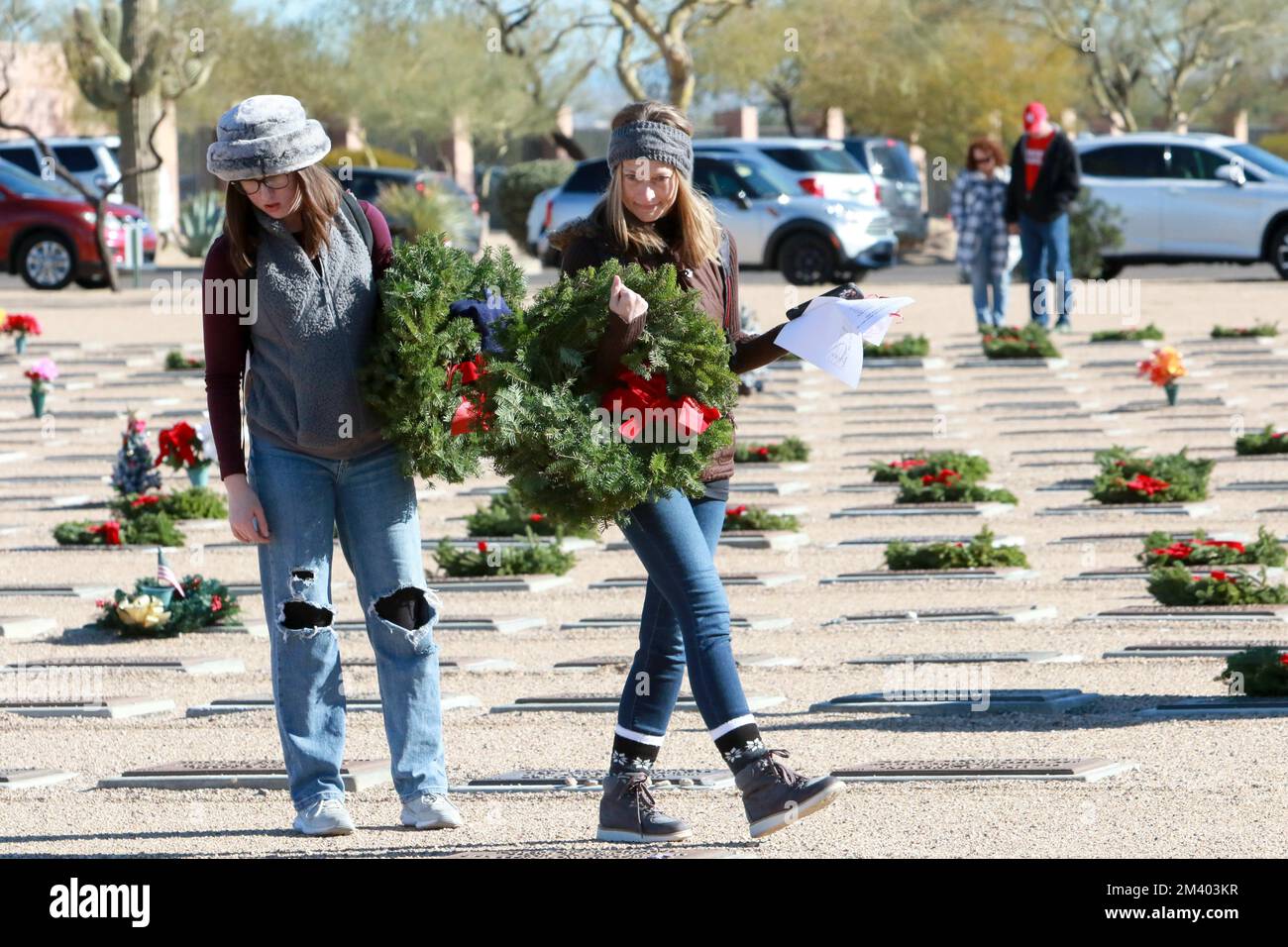Two women search for a particular headstone during the annual Wreaths ...