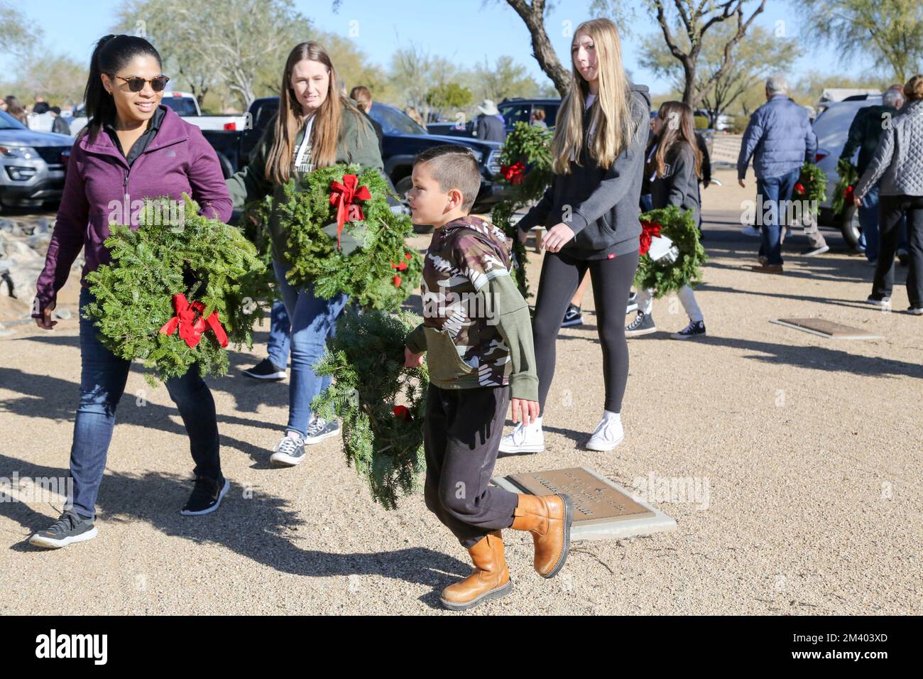 Family members and friends of veterans lay wreaths at the annual ...