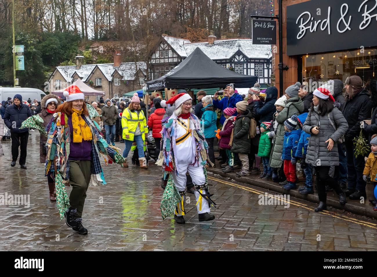 Female Morris Dancers perform in the street during the Grand Parade at