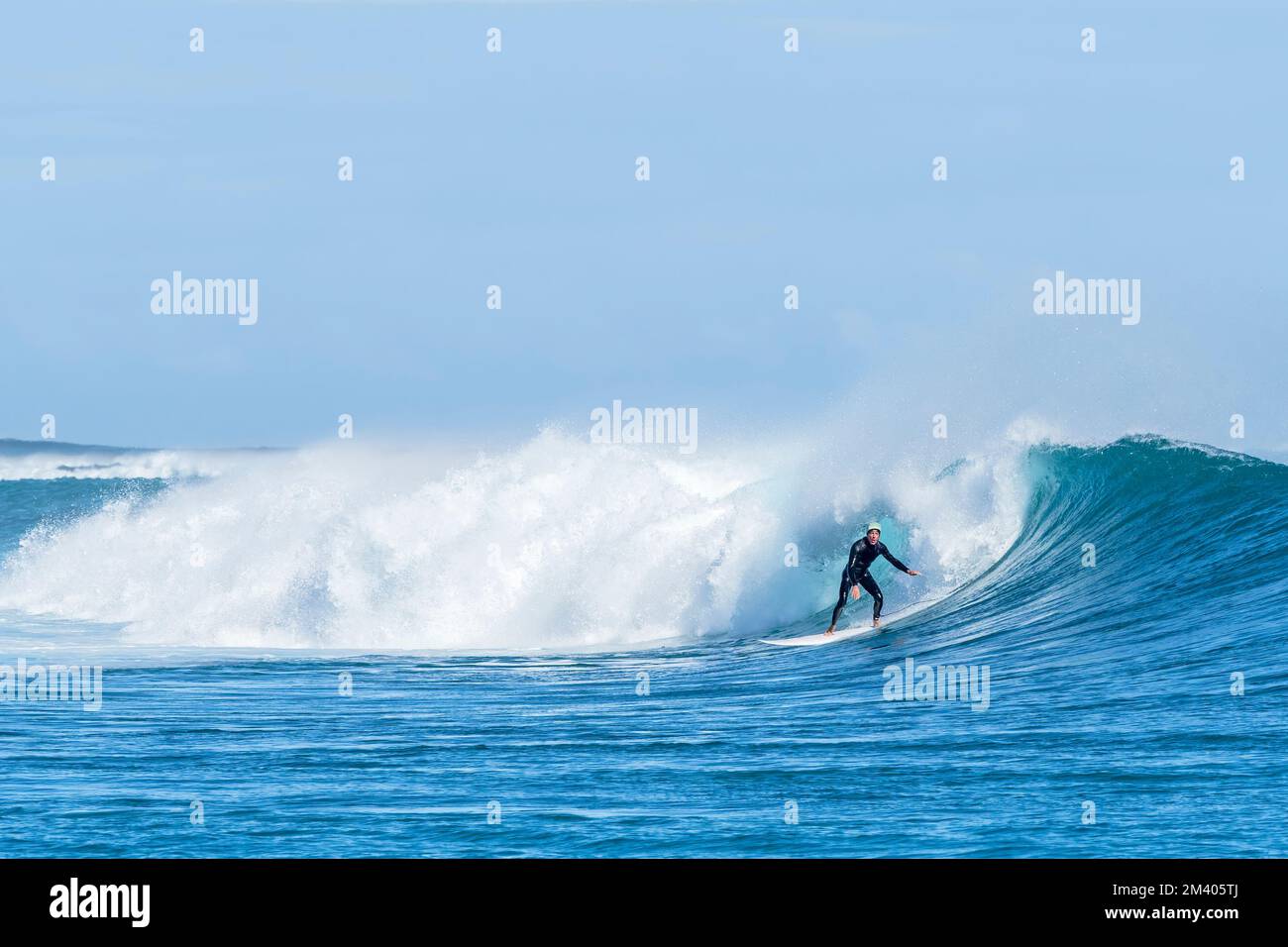 Surfer at Burrow’s surf break, Cape Range National Park, Exmouth, Western Australia, Australia. Stock Photo