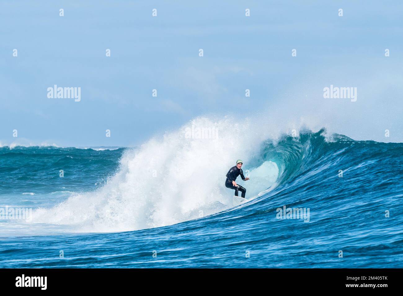Surfer at Burrow’s surf break, Cape Range National Park, Exmouth