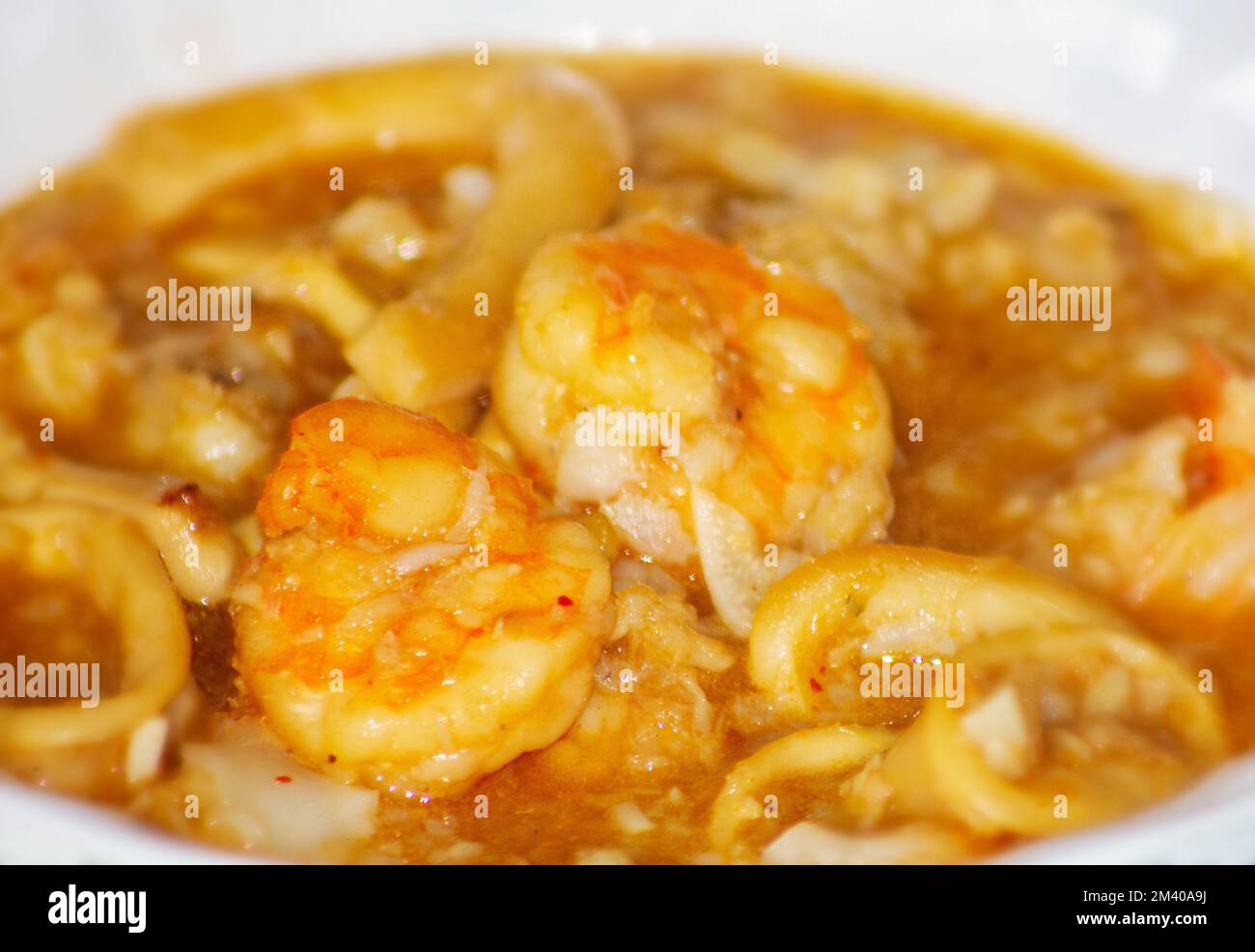 bowl of seafood soup with shrimp, fish and squid Stock Photo