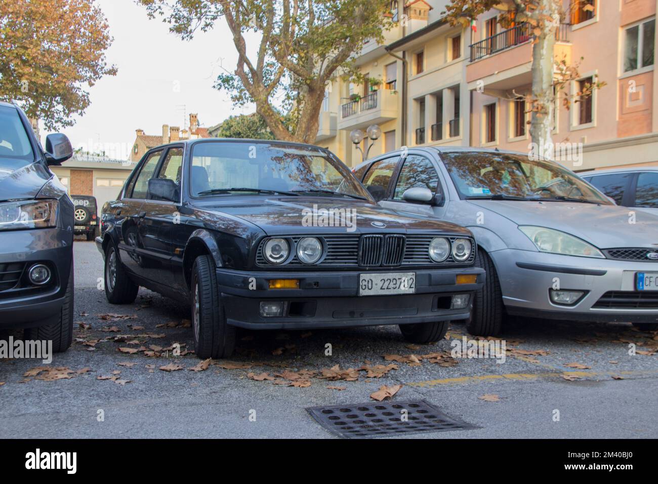 Black BMW 318i (1989)Parking on a City Car Park. View from Front Stock Photo