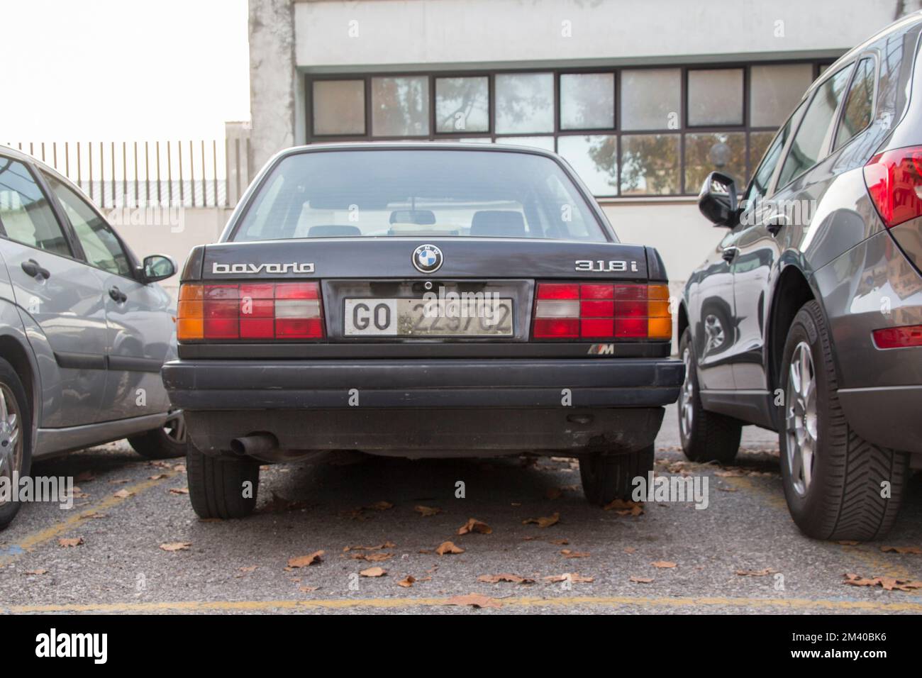 Rear of the Black BMW 318i (1989)Parking on a City Car Park. Stock Photo