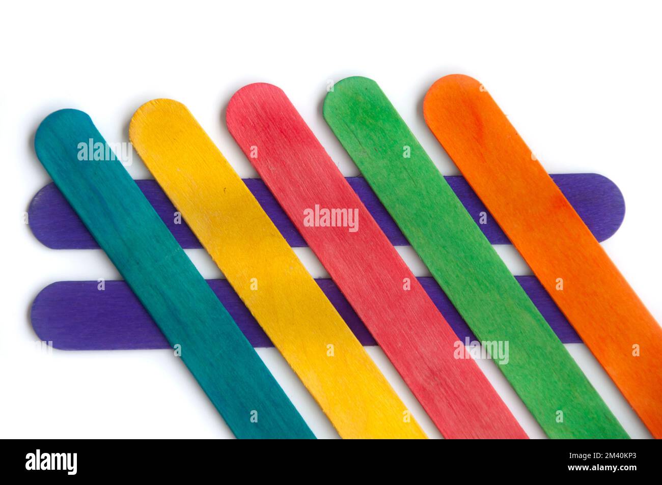 Top view of colored wooden sticks with customizable space for text. Copy space and color background concept. Stock Photo