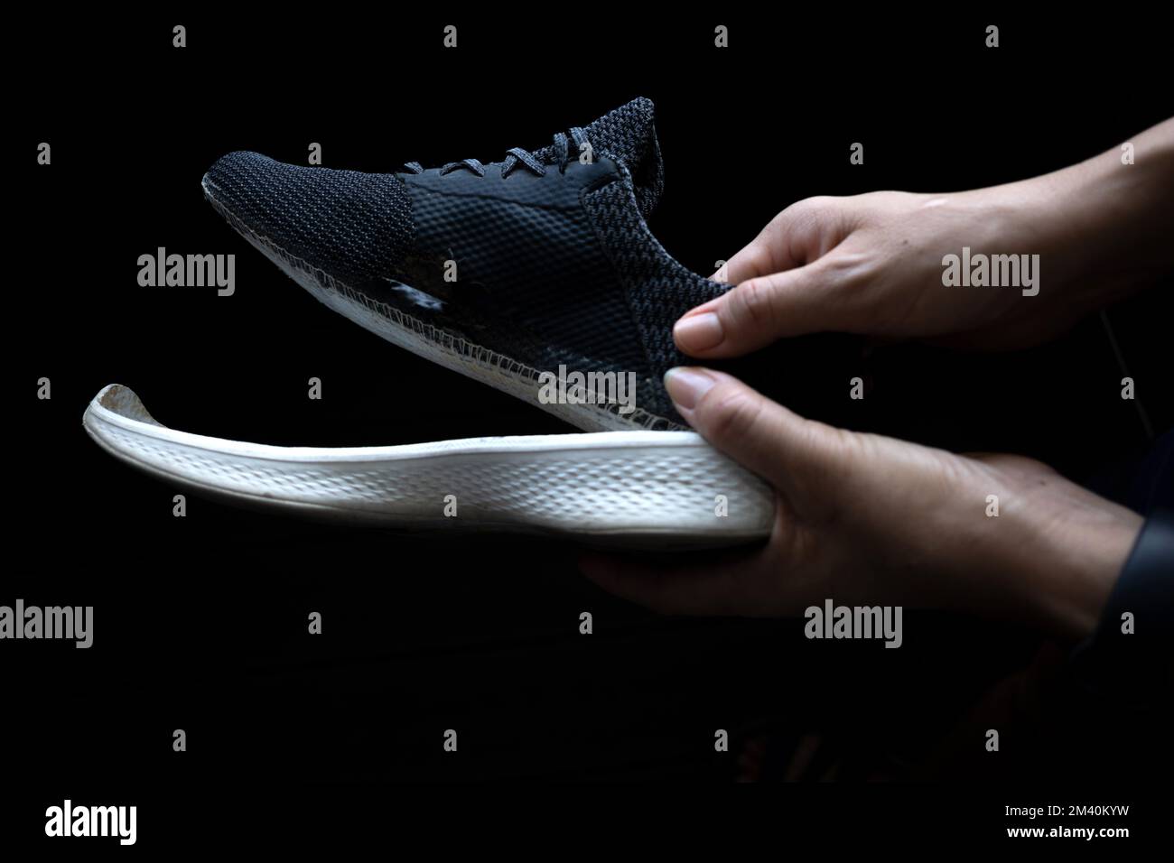 An old spoilt sports shoe with the mid sole coming out Stock Photo Alamy