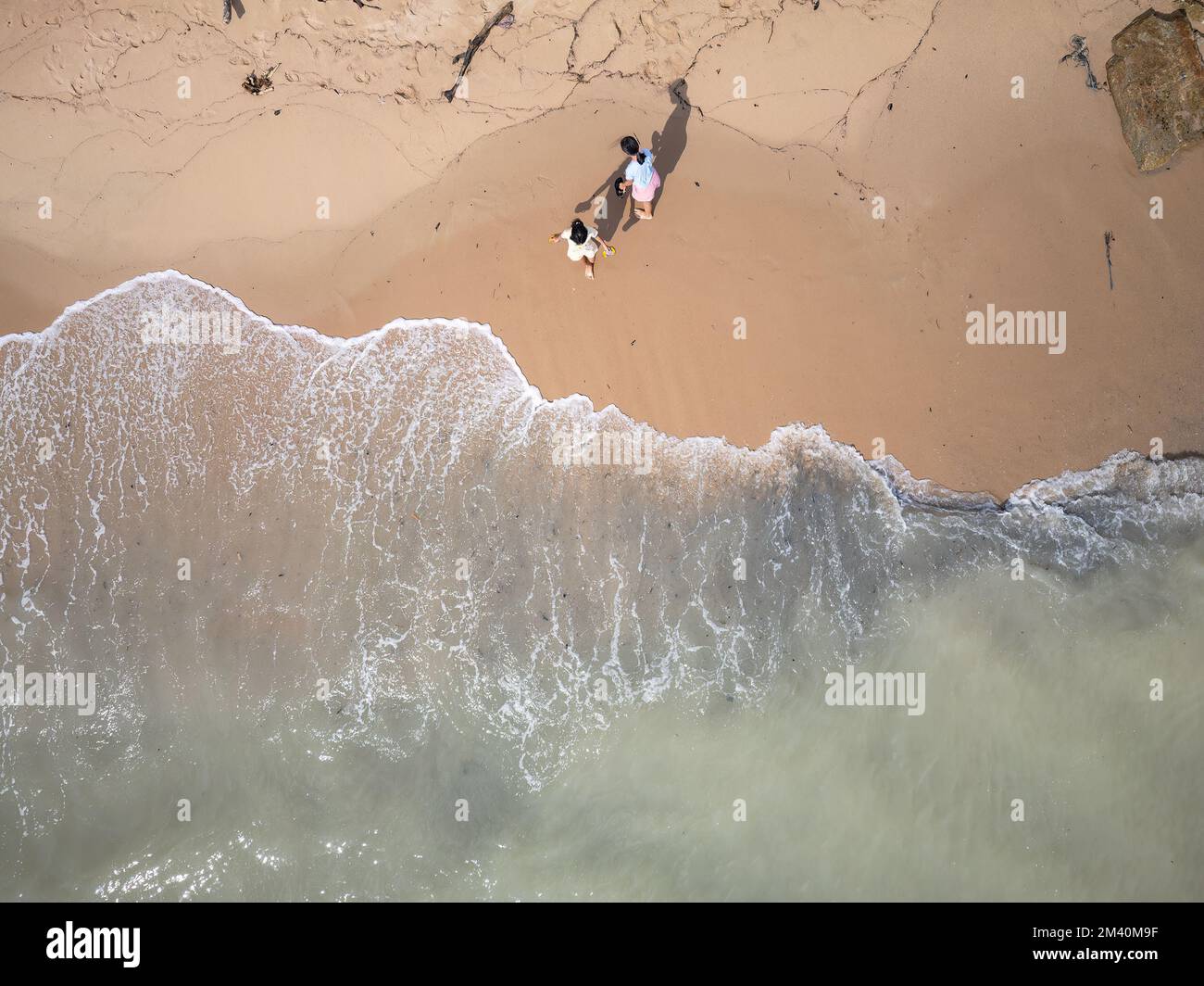 Aearial photo of two girls playing at Phayun Beach in Ban Chang, Rayong