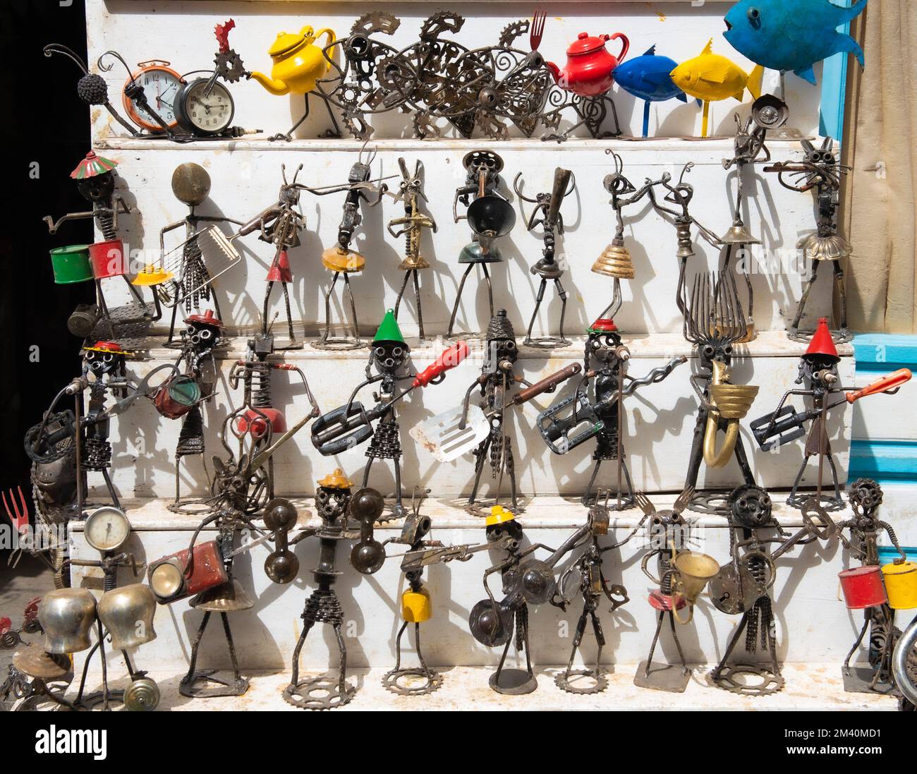 Upcycled metal street art figurines dazzle tourists in Essaouira Morocco's medina. Stock Photo