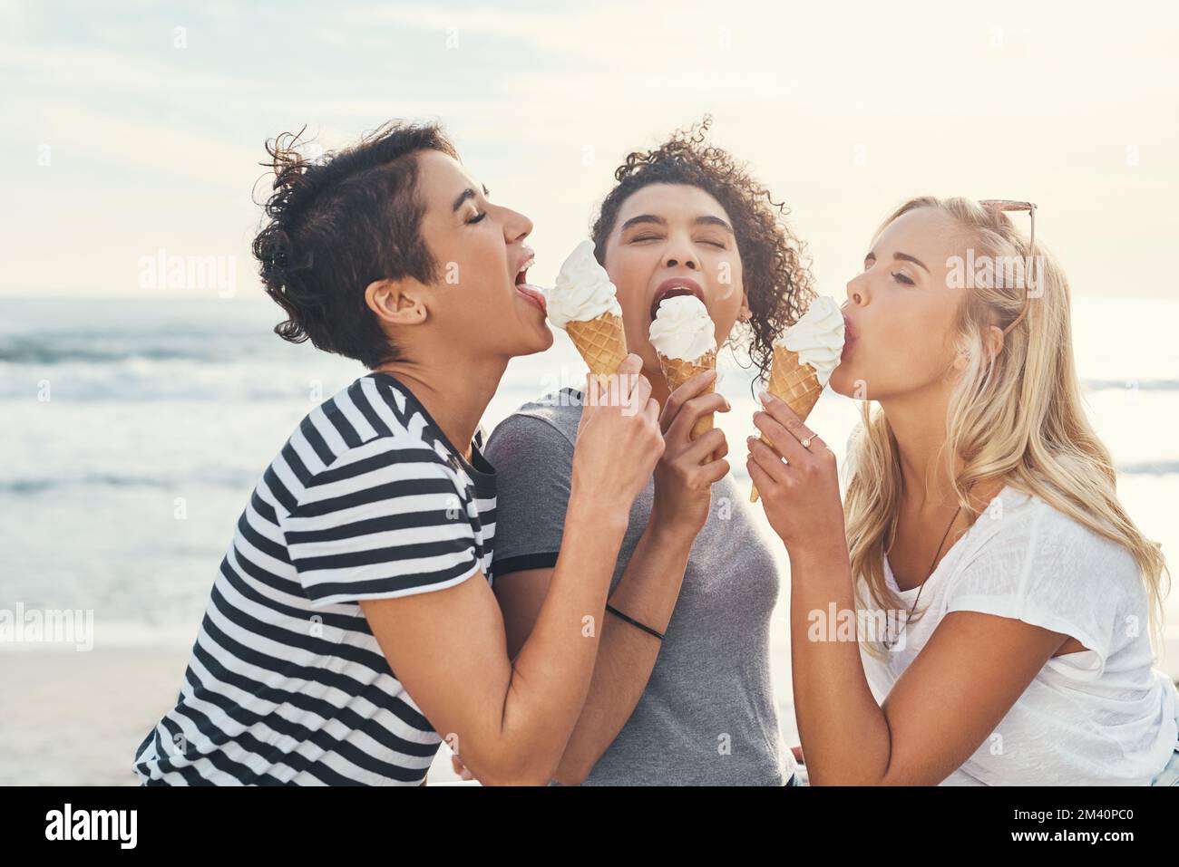 Give us ice cream and no one gets hurt. three friends eating ice while