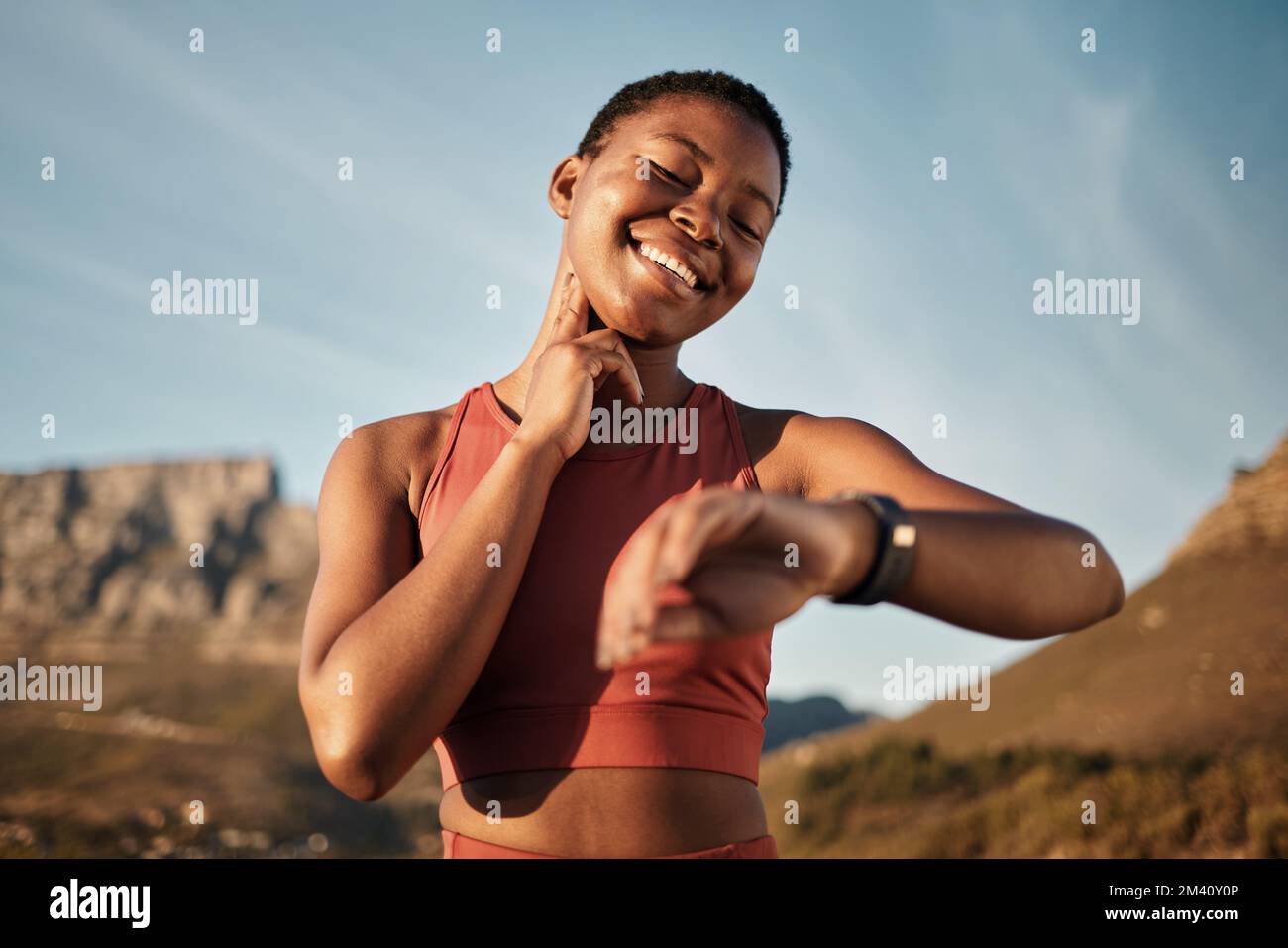 Heart rate, smartwatch and mountain with black woman running for fitness tracker, cardio and monitor goals. Time, sports and workout tracker with girl Stock Photo