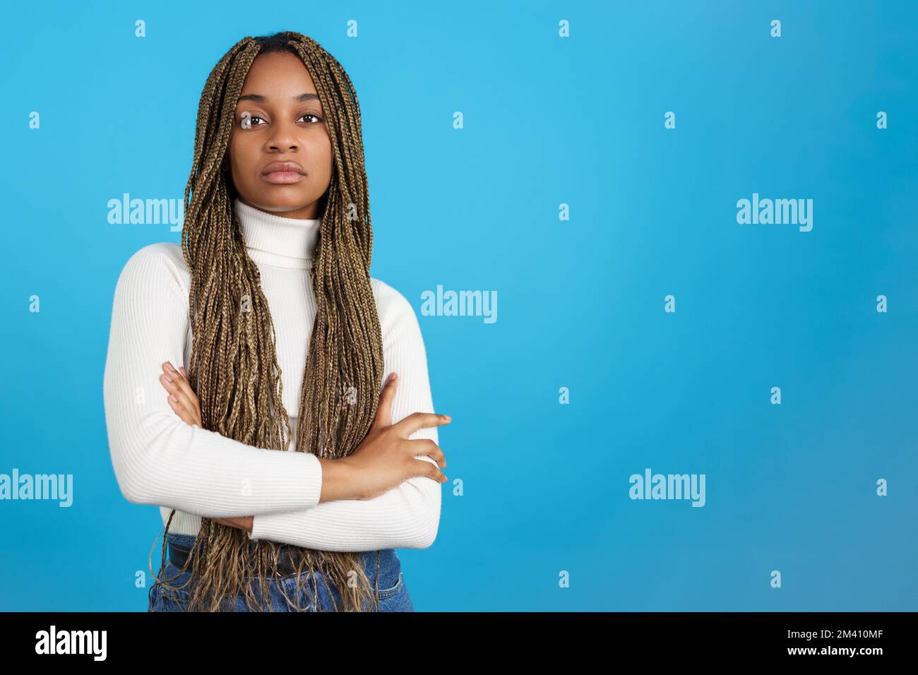 Serious african woman with the arms crossed looking at camera Stock ...
