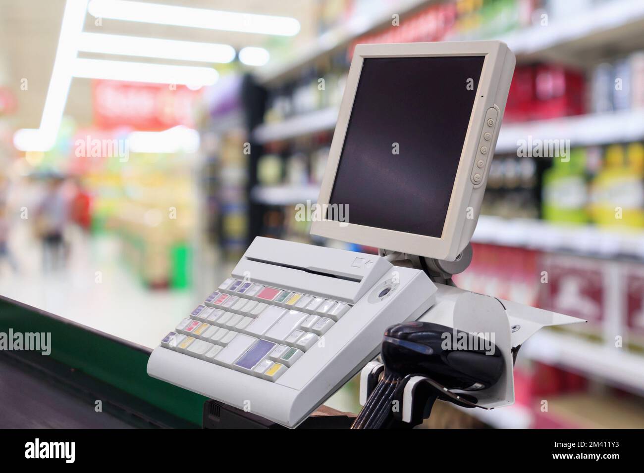 supermarket checkout cash desk counter with payment terminal Stock