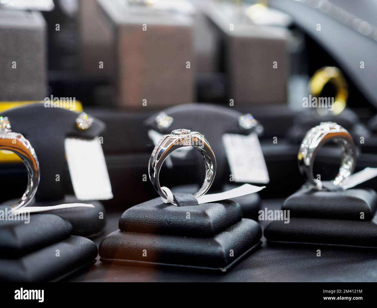 Diamond rings with blank price tag show in jewelry luxury store window display showcase Stock