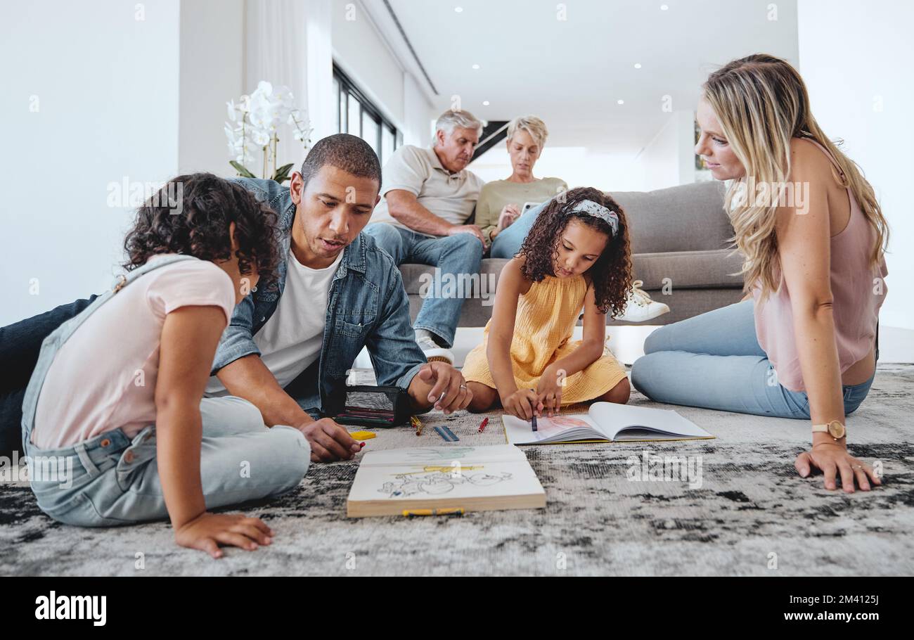 Big family, kids and learning with father in living room, drawing in books and bonding. Education, care and love of parents, man and mother teaching Stock Photo