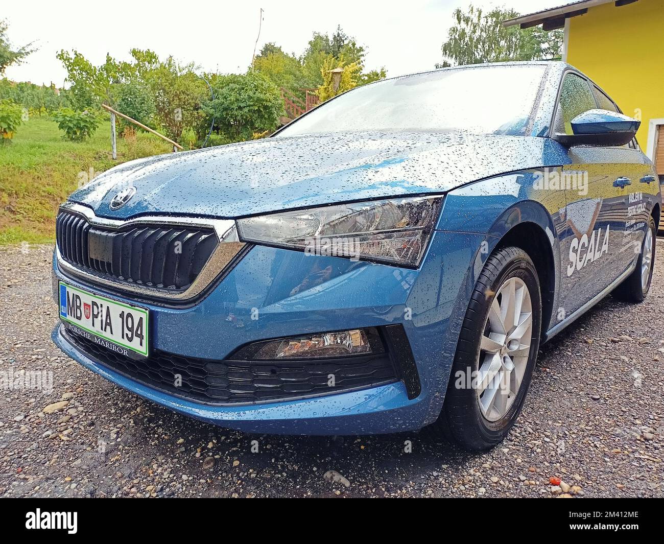 A front view of a blue Skoda Scala 2021 parked on the street Stock Photo