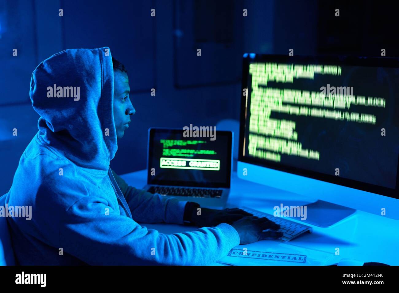 Your firewall is a step over to him. a young male hacker cracking a ...