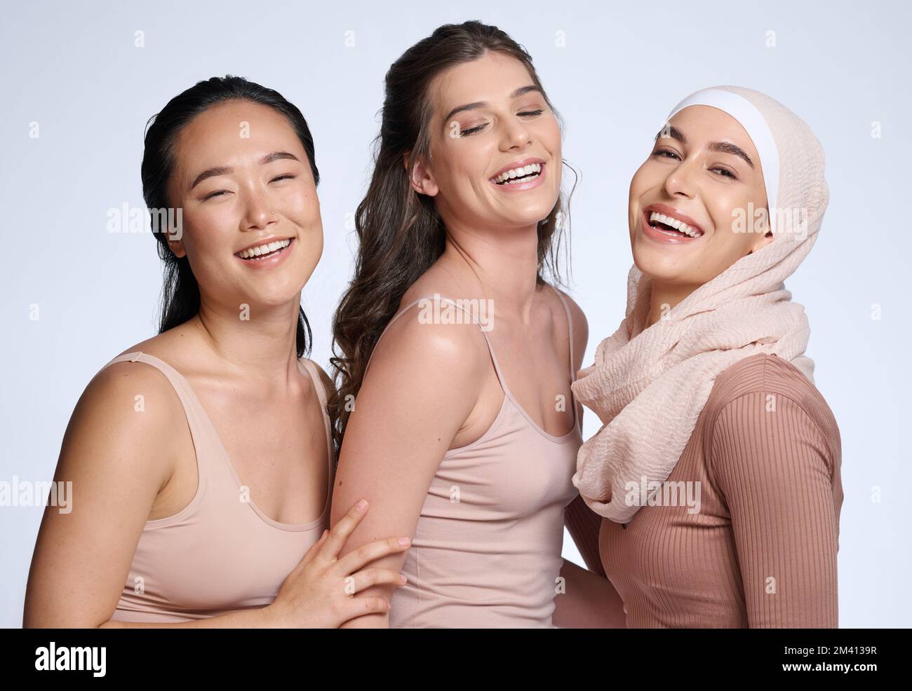 Face, beauty skincare and group of women in studio isolated on gray background. Diversity, cosmetics and portrait of girls, friends or female models Stock Photo