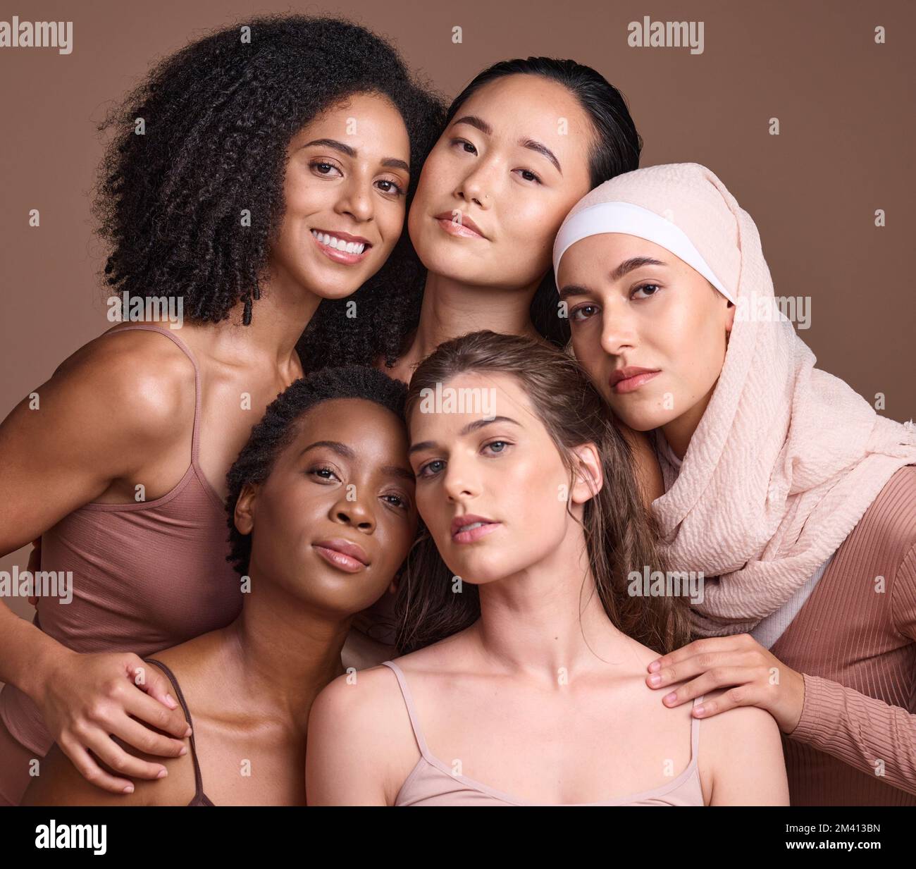 Diversity, beauty and portrait of a group of women in studio for skincare, makeup or cosmetic routine. Feminism, female empowerment and face of Stock Photo