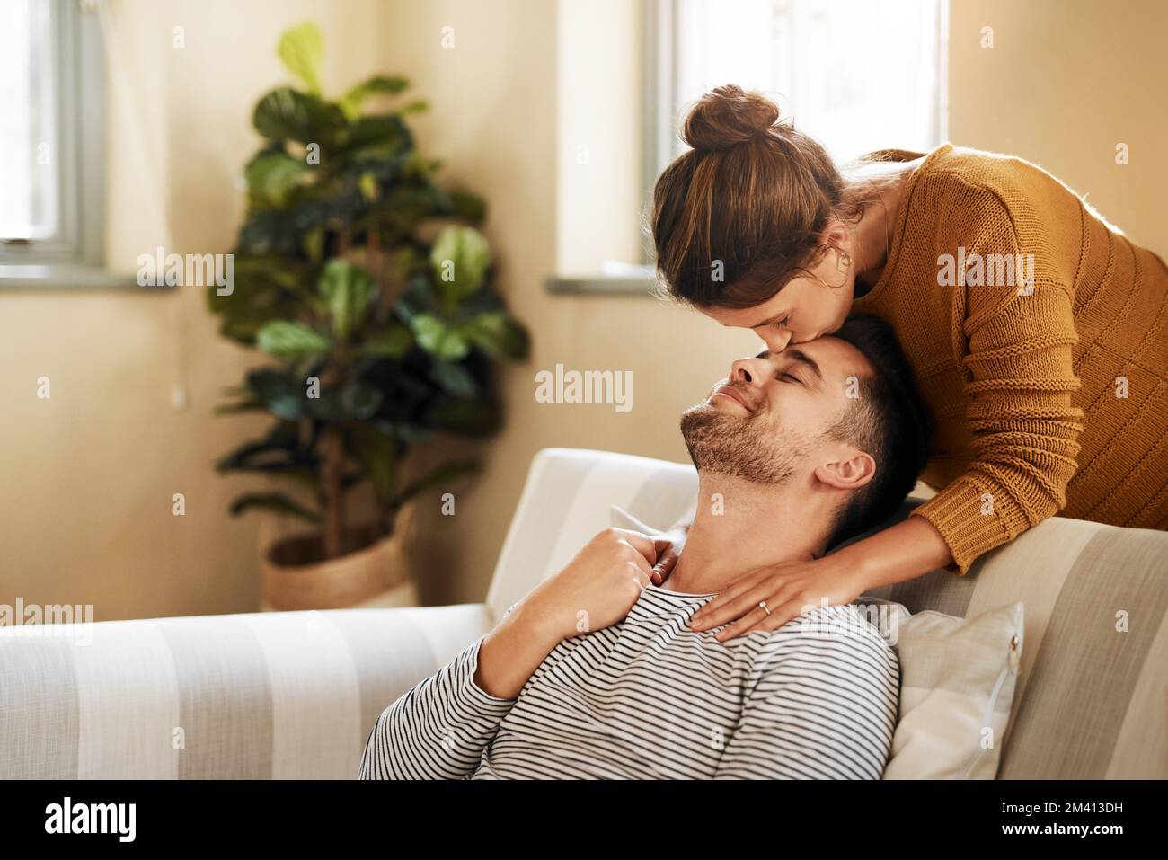Im so lucky to have you. an affectionate couple spending quality time together at home. Stock Photo