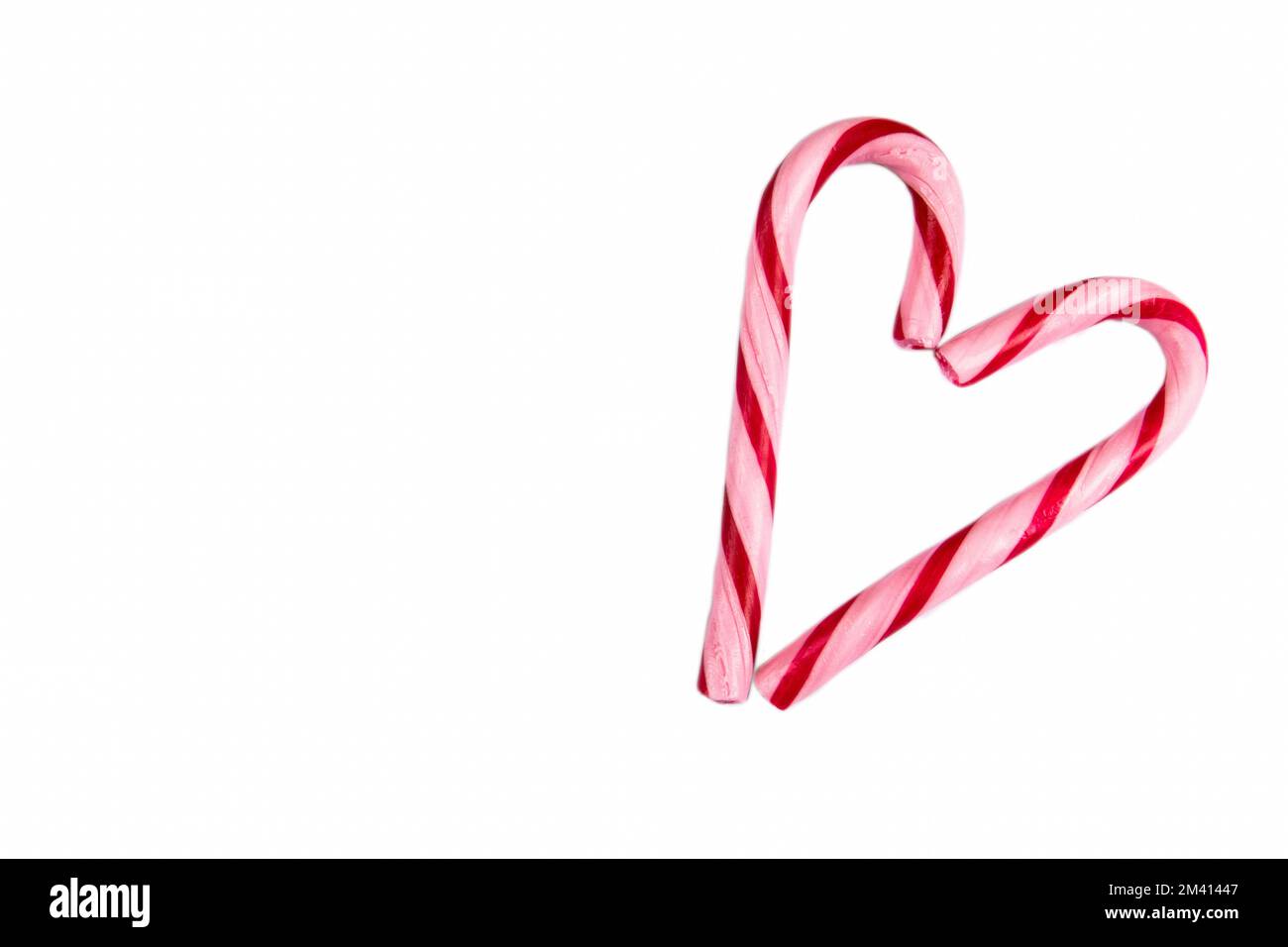 Heart shaped candy cane isolated on a white background. Stock Photo
