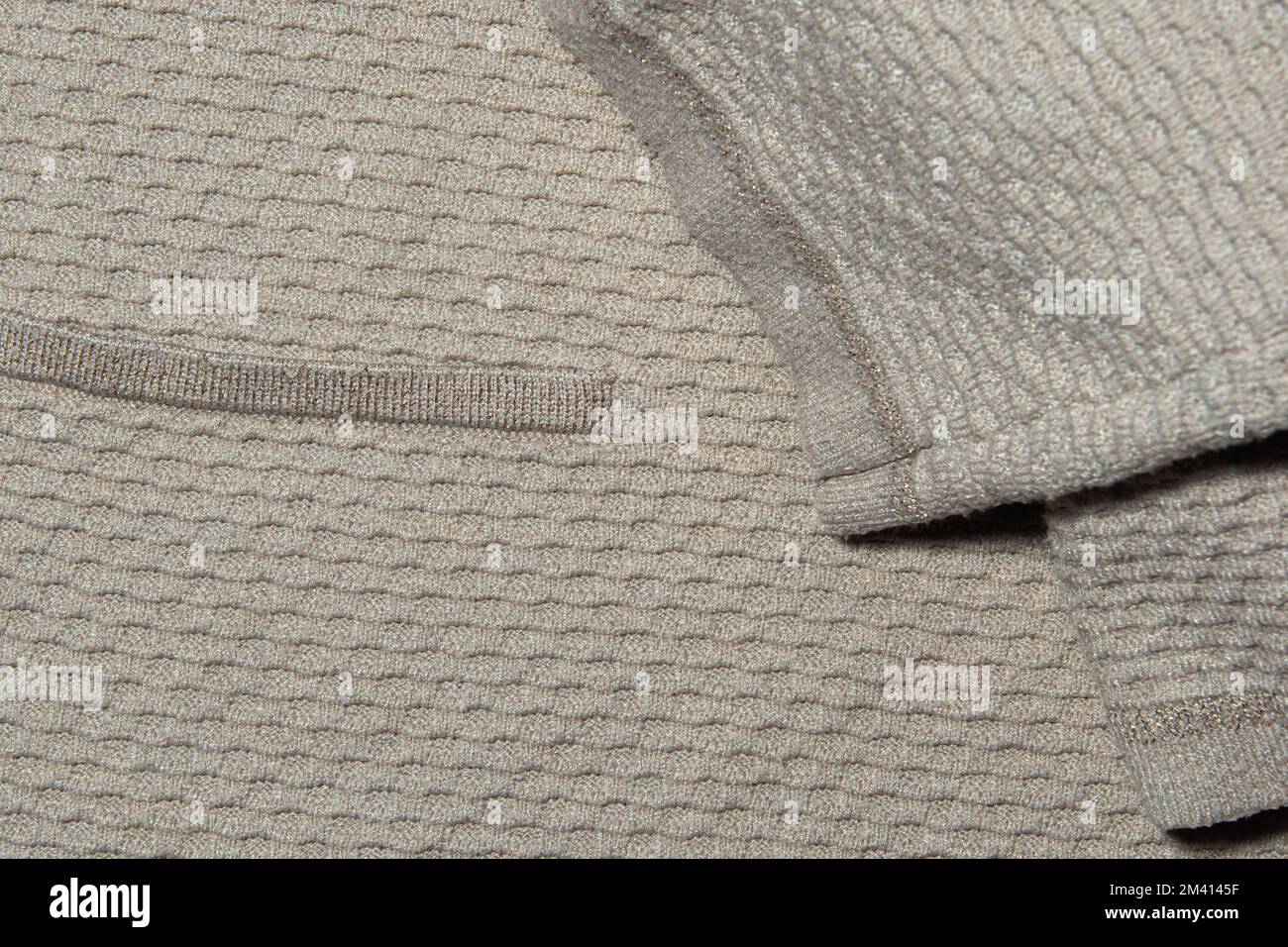 Finishing the edges of a knitted garment. Factory knitting Stock Photo