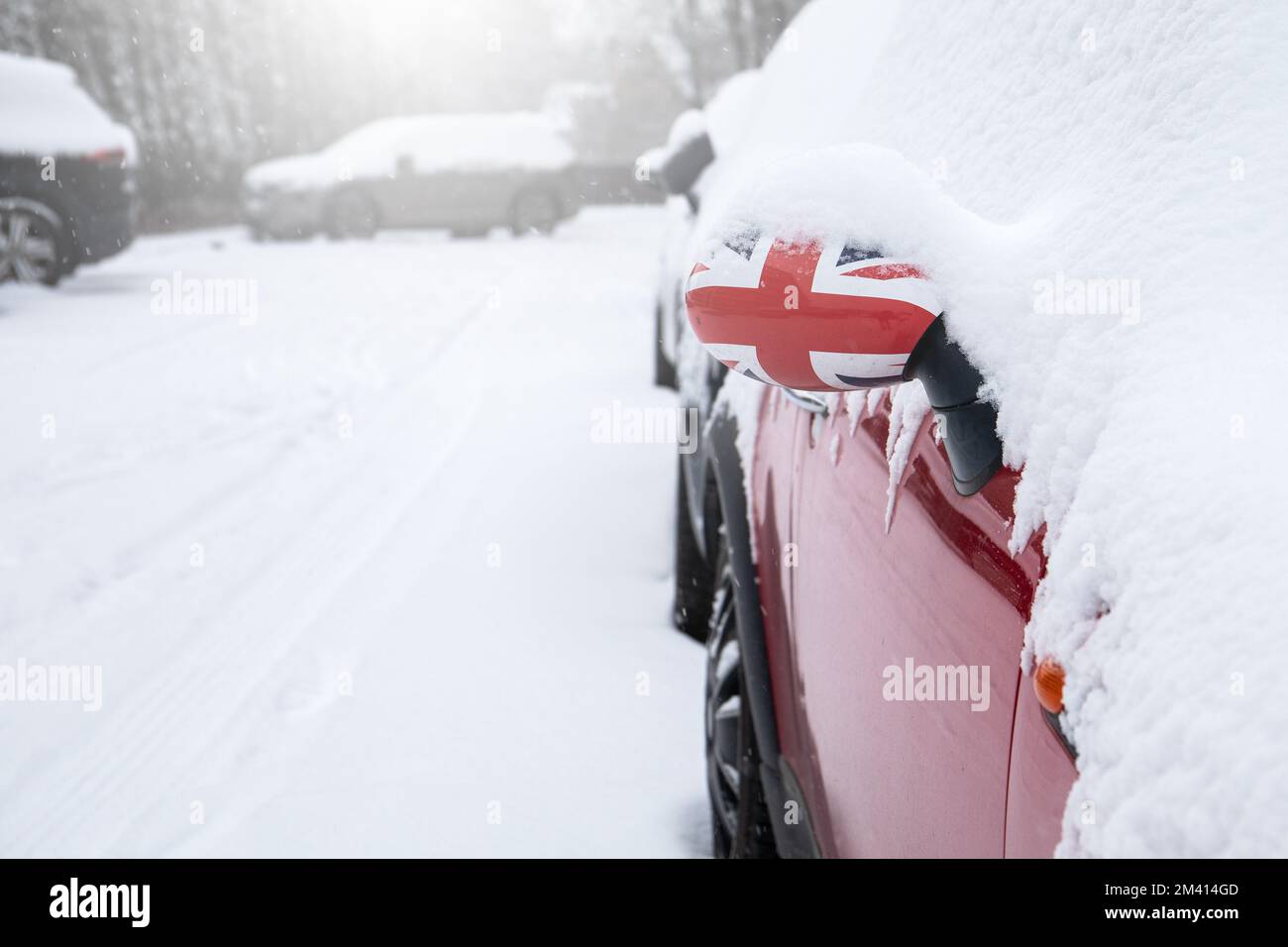 Snowy parking lot. Snowfall and storm. British flag. Stock Photo