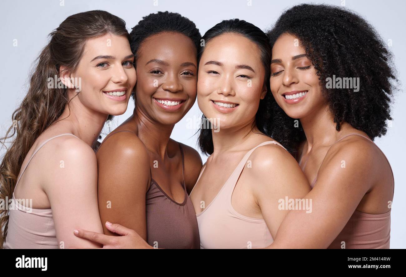 Face portrait, beauty and group of women in studio on gray background. Cosmetics, makeup and diversity of female models with glowing and flawless skin Stock Photo